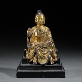 A BRONZE-GILT SEATED SHAKYAMUNI