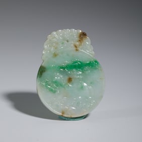 A CARVED JADEITE PLAQUE