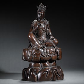 A CARVED ALOES WOOD CHENXIANG SEATED GUANYIN