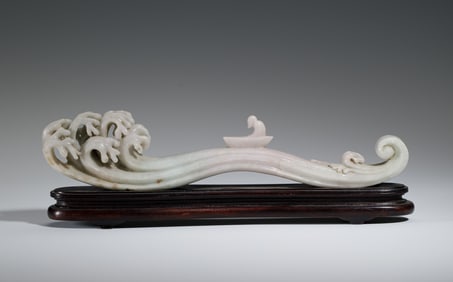 A CARVED JADEITE DECORATION