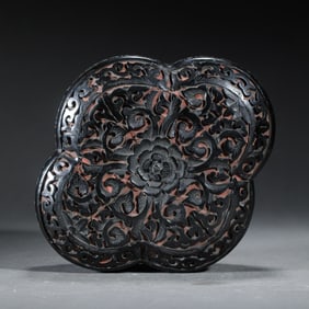 A CARVED CINNABAR LACQUER BOX WITH COVER