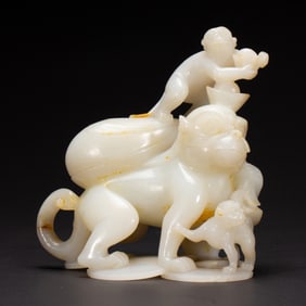 A CARVED WHITE JADE MONKEYS GROUP