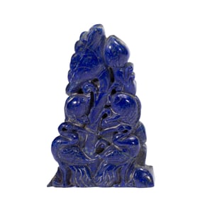A CARVED LAPIS DECORATION
