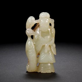 A CARVED WHITE JADE IMMORTAL MAGU