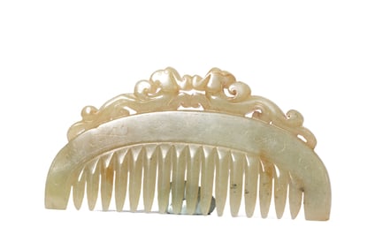 A CARVED WHITE JADE COMB