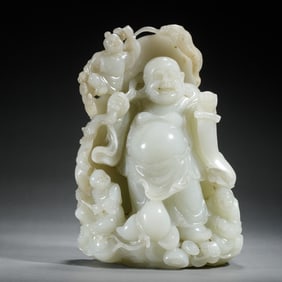 A CARVED WHITE JADE BUDAI