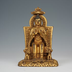 A BRONZE-GILT SEATED MAITREYA
