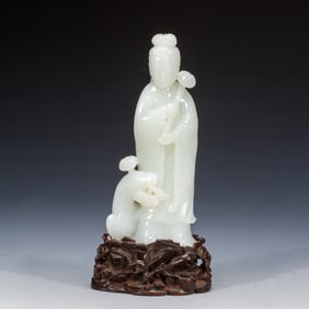 A CARVED WHITE JADE GODDESS
