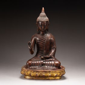 A CARVED ALOES WOOD SEATED BUDDHA