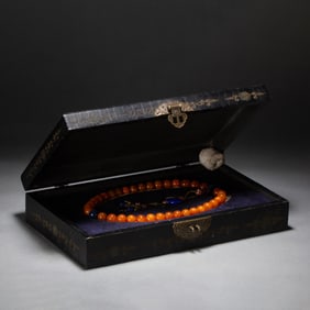 A CHINESE IMPERIAL AMBER PRAYER BEADS SHOUCHUAN