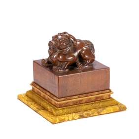 A CARVED ALOES-WOOD MYTHICAL BEAST SEAL