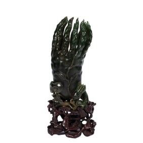 A CARVED SPINACH GREEN JADE FINGERED CITRON