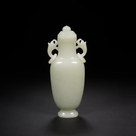 A CARVED WHITE JADE BALUSTER VASE WITH COVER