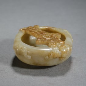 A CARVED JADE WASHER