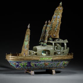 A CARVED JADE INLAID BRONZE SHIP