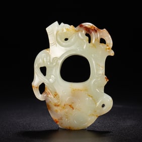 A CARVED WHITE JADE ORNAMENT SHE
