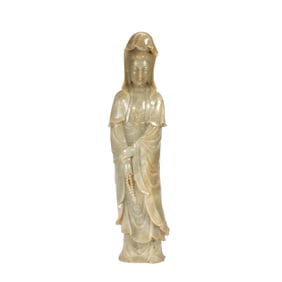 A CARVED JADE STANDING GUANYIN
