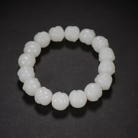 A CARVED JADE BRACELET