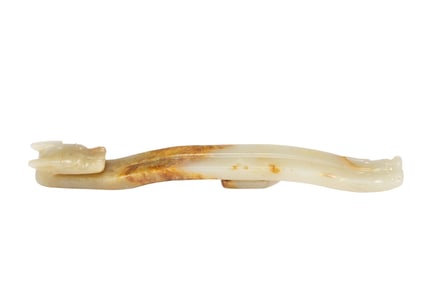 A CARVED WHITE JADE DRAGON BELTHOOK