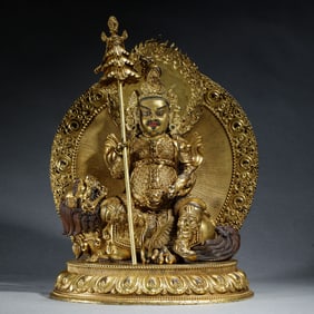 A BRONZE-GILT GOD OF WEALTH