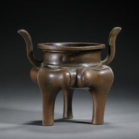 A BRONZE TRIPOD CENSER