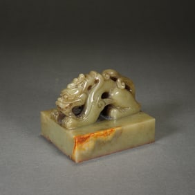 A CARVED JADE DRAGON SEAL