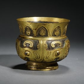 A BRONZE PARTLY GILT TAOTIE VESSEL ZUN