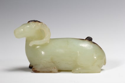 A CARVED JADE RAM