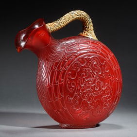 A CARVED PEKING GLASS POURING VESSEL