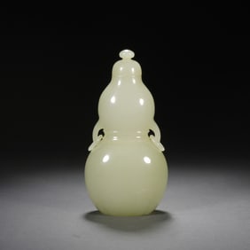 A CARVED WHITE JADE DOUBLE GOURDS