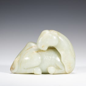 A CARVED WHITE JADE CAMEL