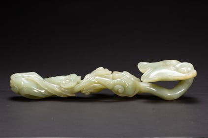 A CARVED WHITE JADE RUYI SCEPTER