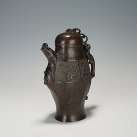 A BRONZE TAOTIE WINE VESSEL
