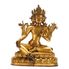 A BRONZE-GILT SEATED GREEN TARA