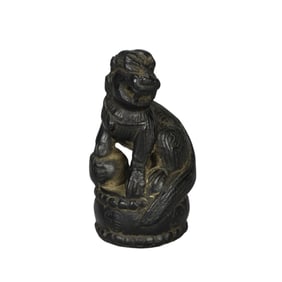 A CARVED STONE FELINE