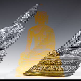 A BRONZE-GILT SEATED SHAKYAMUNI: A BRONZE-GILT SEATED SHAKYAMUNI The present image of the historical Buddha, Shakyamuni, is a paragon of the Tibetan sculptural tradition. The Buddha is seated in vajrasana, the classical diamond postu