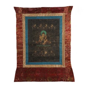 A TIBETAN THANGKA OF SEATED PROTECTOR