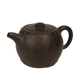 AN INSCRIBED YIXING GLAZE TEAPOT
