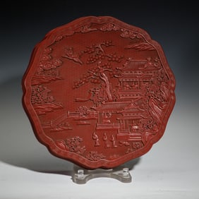 A CARVED CINNABAR LACQUER FIGURAL STORY BOX WITH COVER