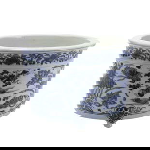 A BLUE AND WHITE PORCELAIN CENSER: A BLUE AND WHITE PORCELAIN CENSER Of cylindrical form with a flaring mouth, raising from tripod feet, decorated with lotus pond scene at the exterior. DIMENSIONS: Diam. 28 cm. H. 18 cm. Weight 3990 gr