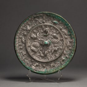 A BRONZE MYTHICAL BEAST MIRROR