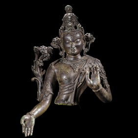 A COPPER ALLOY TORSO OF TARA