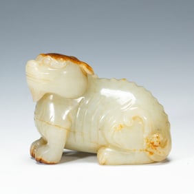 A CARVED WHITE JADE BEAST
