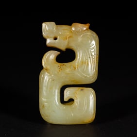 A CARVED WHITE JADE ORNAMENT