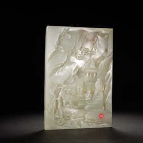 A CARVED WHIRE JADE PANEL