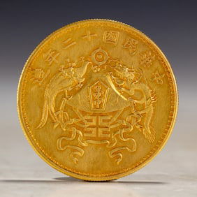 A SILVER-GILT COIN