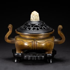 A BRONZE-GILT INCENSE BURNER