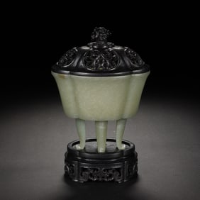 A CARVED JADE TRIPOD CENSER