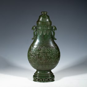 A CARVED SPINACH GREEN JADE VASE MUGHAL STYLE