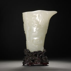 A CARVED WHITE JADE LIBATION CUP